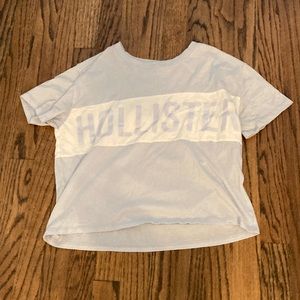 light blue and white hollsiter brand name flowy tee in size s